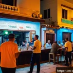 키프로스 범죄율과 안전 정보 - A vibrant evening street scene in Ayia Napa, Cyprus, showcasing a lively but safe nightlife atmosphe...